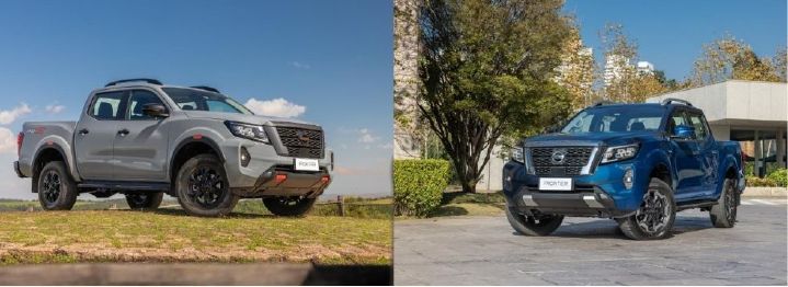 Duas picapes Nissan Frontier, uma cinza em área com gramado com cerca de madeira e outra azul em área pavimentada com árvores e prédios ao fundo