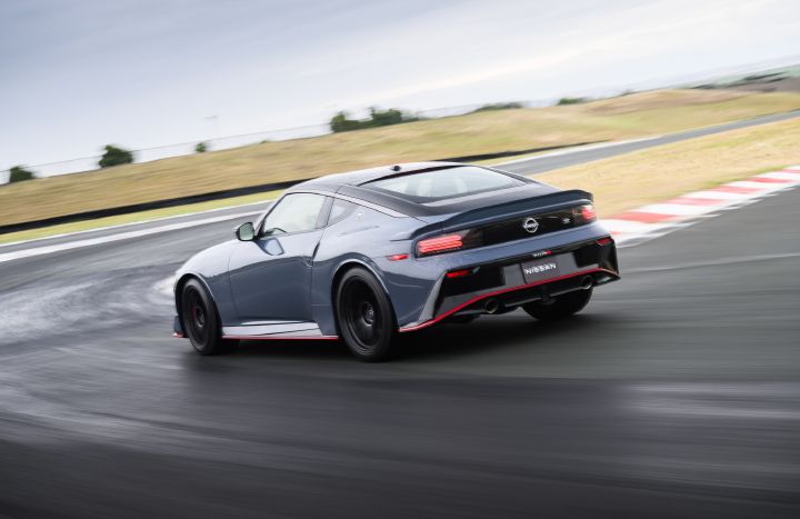 Angled rear view of the 2027 Nissan Z NISMO Manual Transmission curving around a racetrack.