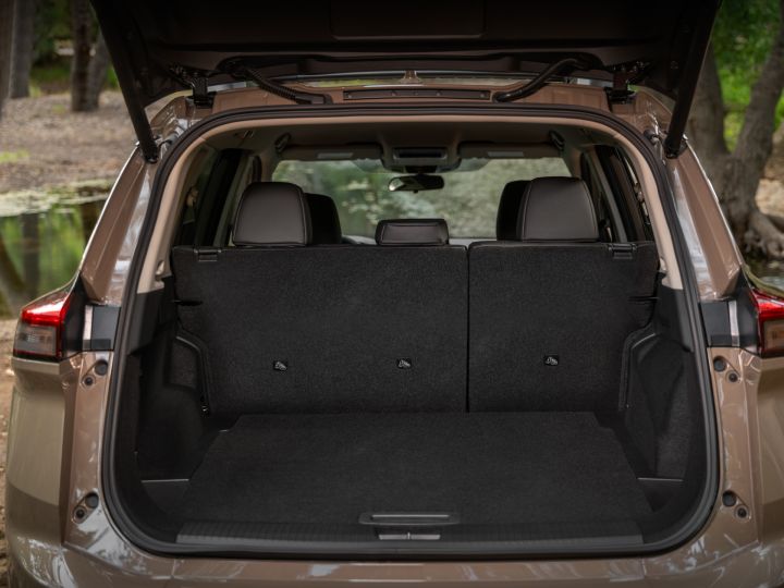 The open and empty black felted trunk of the 2025 Nissan Rogue rock creek.