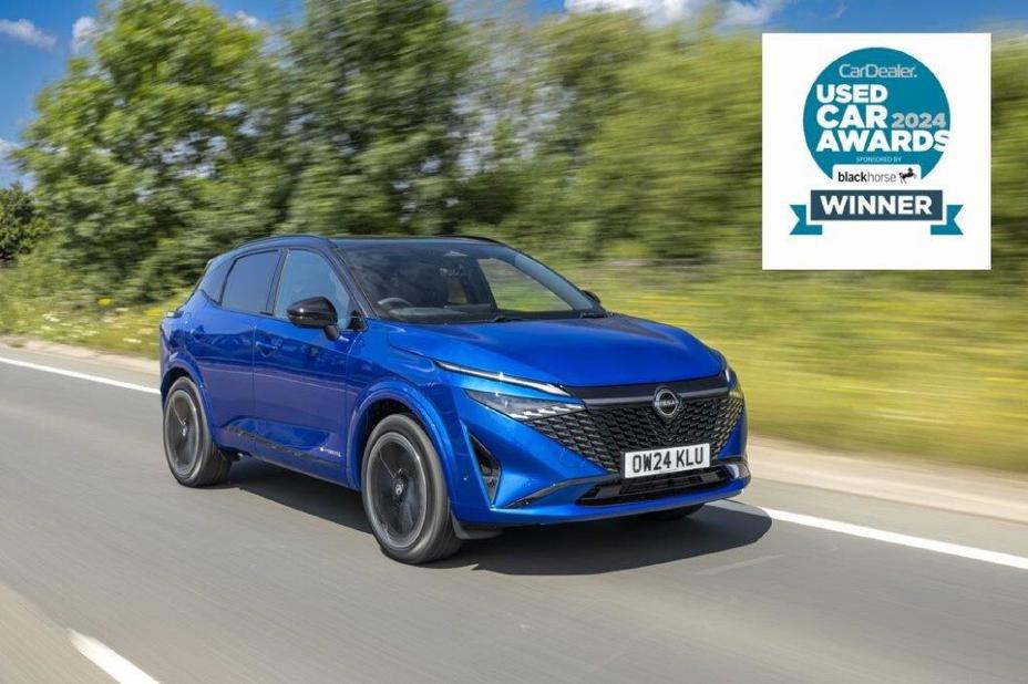 Bright blue 2024 Nissan Qashqai N-Design driving along a country road in the sunshine with the Used Car Awards logo in the corner of the image