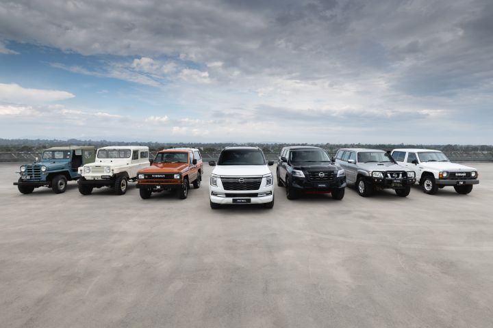 A row of seven Nissan Patrol vehicles on a carpark rooftop
