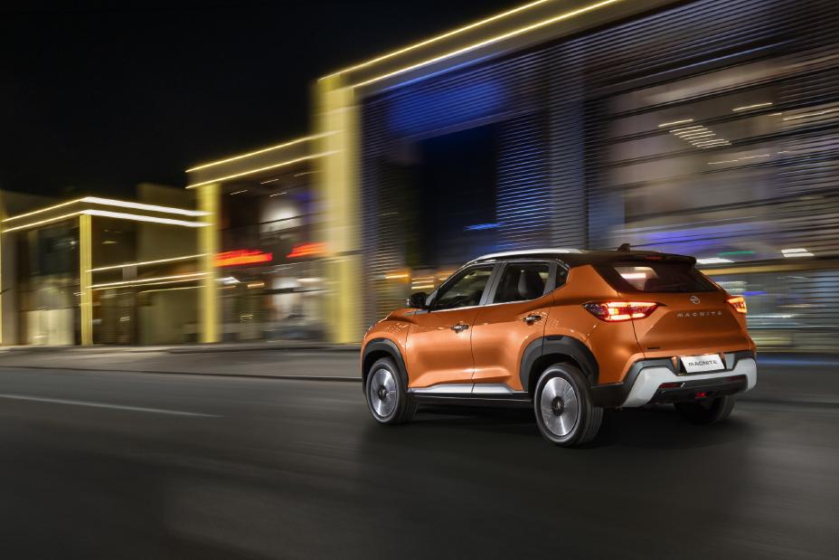 Magnite driving on the road from the side