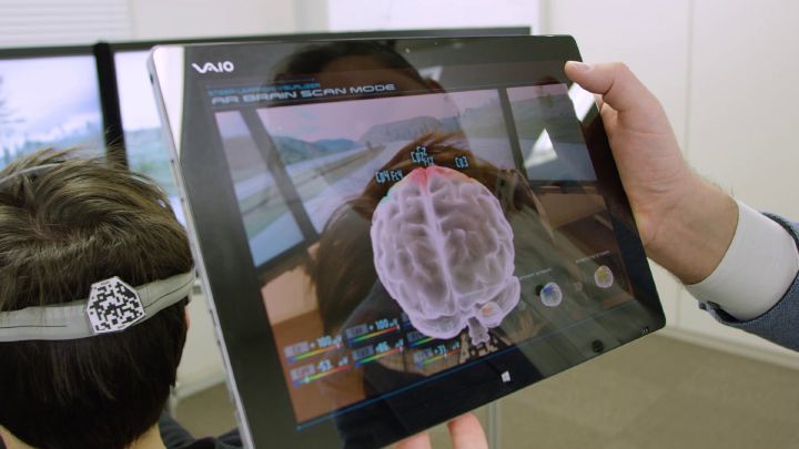 A person holding a tablet