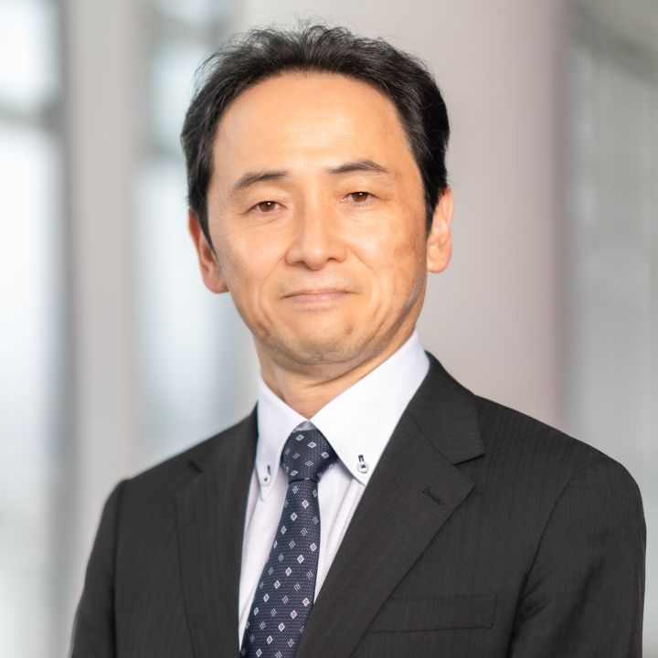 Portrait of Eiichi Akashi (suit, tie and NISSAN corporate pin)