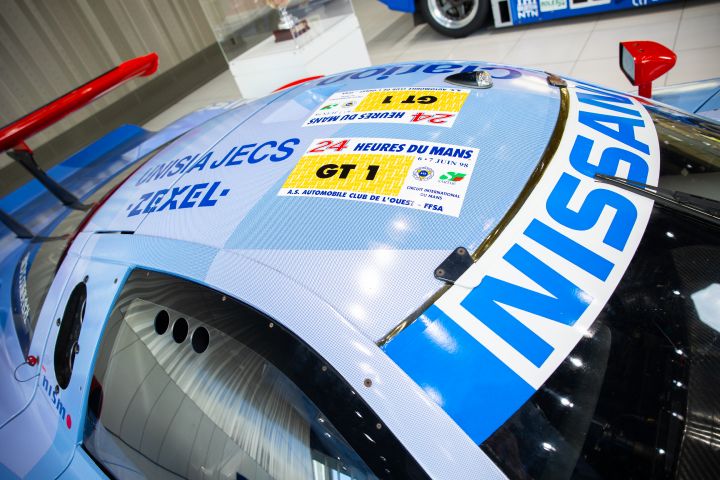The roof of a blue Nissan R390 GT1 Le Mans race car with GT1 category decals.