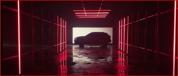 ilhueta do novo Nissan Kicks em túnel escuro com iluminação de luzes de LED vermelhas e fundo branco