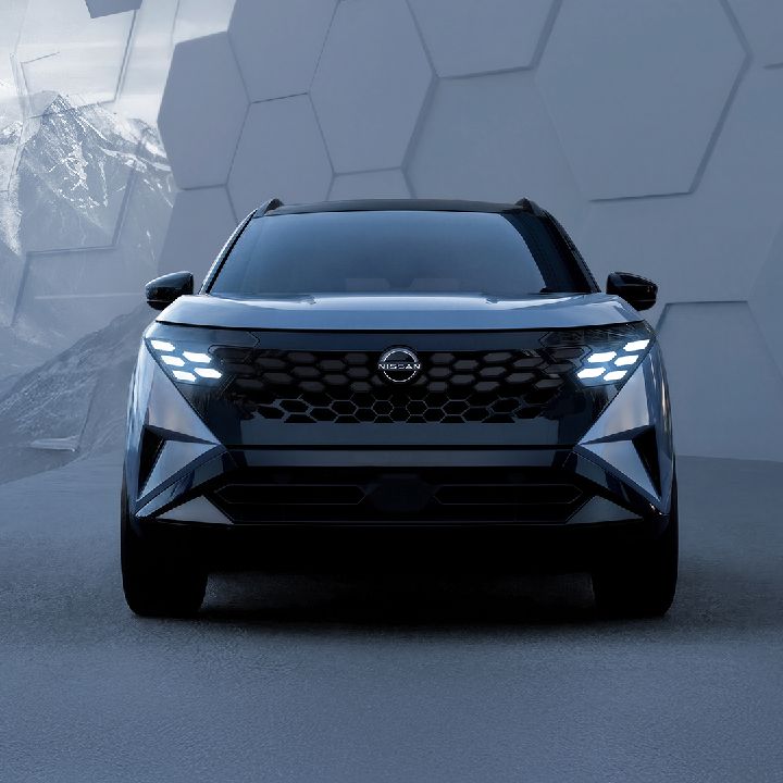 Front view of the 2027 Rogue Hybrid e‑POWER against a hexagonal background,