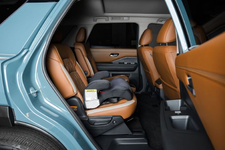 A child safety sear as viewed from the rear passenger door inside the 2026 Nissan Pathfinder.