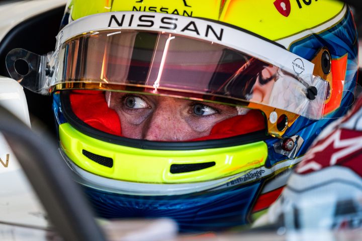 Oliver Rowland with his helmet on and visor up while waiting to go out on-track in the #1 car during Pre-Season Testing.