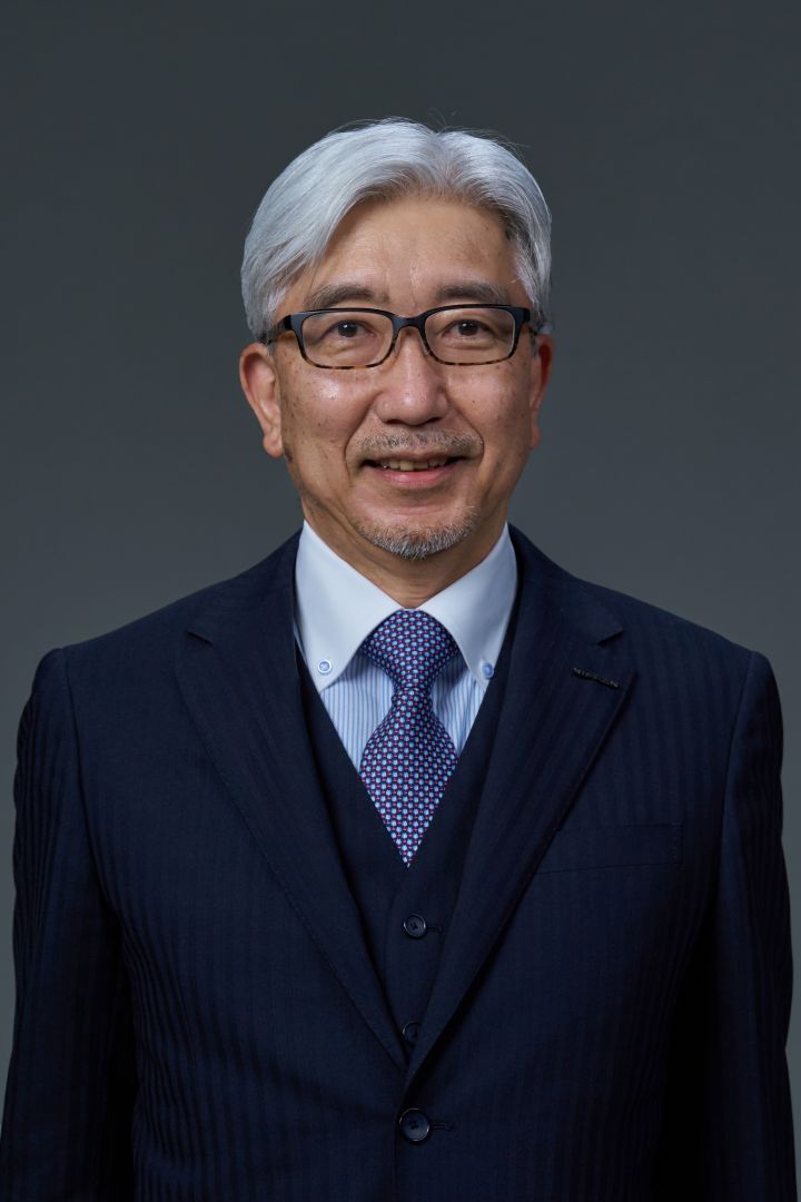 Portrait of Mitsuro Antoku (suit, tie and NISSAN corporate pin) (smiling)