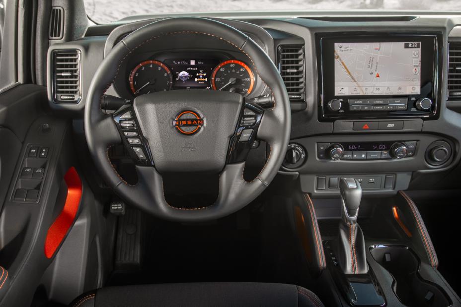 Driver side POV of the steering wheel in the 2022 Nissan Frontier.