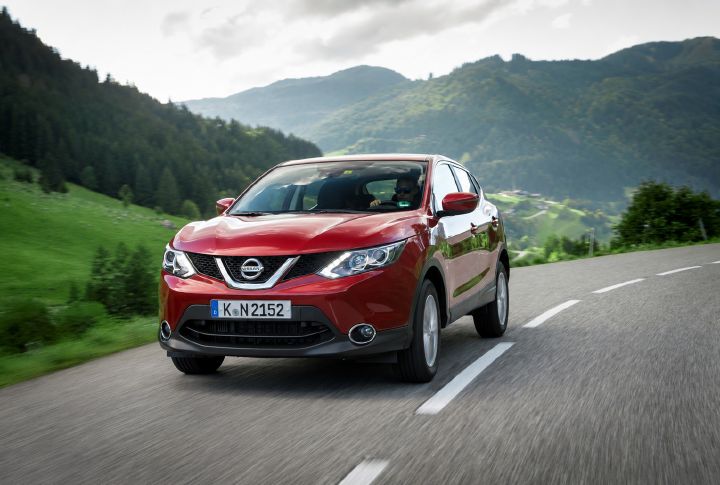A second generation Qashqai driving through a rural setting
