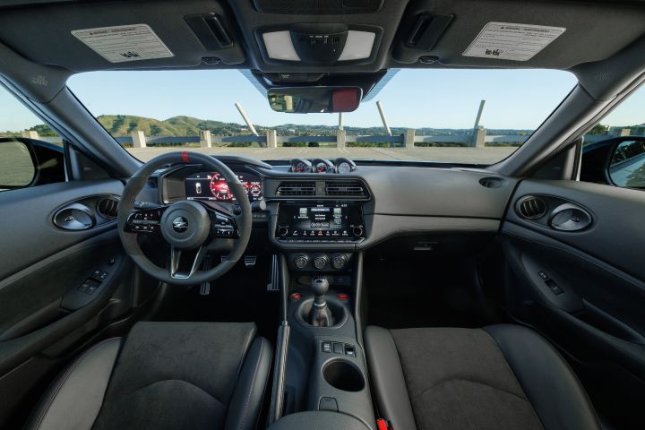 The steering, dashboard and windshield inside the 2027 Nissan Z NISMO MT.