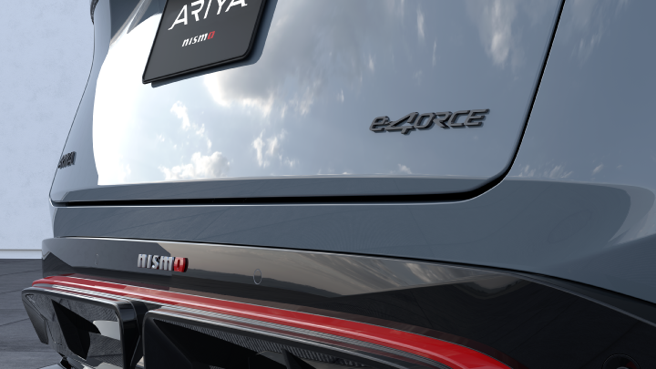 Close up - Rear shot of Ariya NISMO showing e‑4ORCE and NISMO logos as well as the twin diffuser