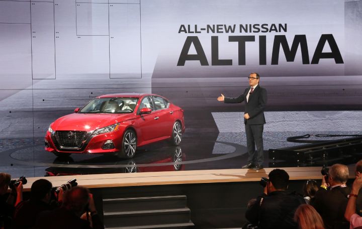 A red Nissan Altima being revealed in New York