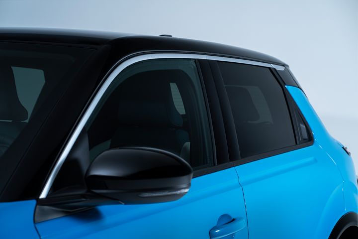 Side detailed view of Micra driver exterior door and passenger door with black roof and ice screen gelato scoop line on the side.