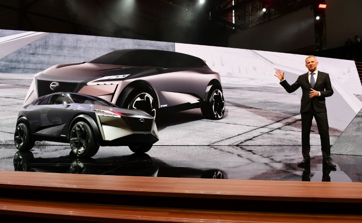A man on stage presenting the Nissan IMQ concept