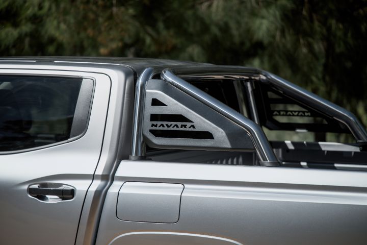 2026 Nissan Navara ST dual cab ute finished in Summit Silver shown in a tray-side detail featuring the sports bar, black inserts and NAVARA branding.