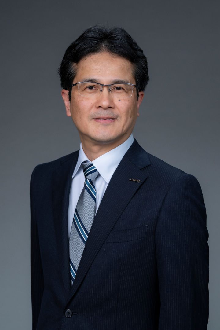 Portrait of Teiji Hirata (suit, tie and NISSAN corporate pin)