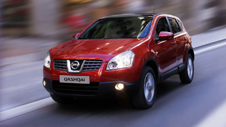 A second generation Qashqai driving down a road at speed
