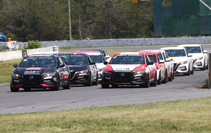 Nissan Sentra Cup cars lined up before a race.