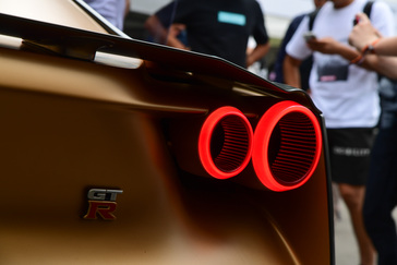 A close up of the rear tail light and trunk badge on the Nissan GT-R50