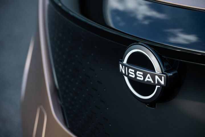 Close-up of a Nissan badge on a Nissan Ariya
