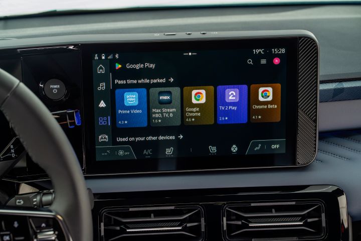 Detailed view of infotainment screen showing apps on Google Play store