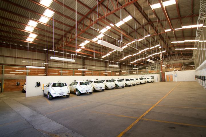 electric Nissan LEAF vehicles parked in a car lot
