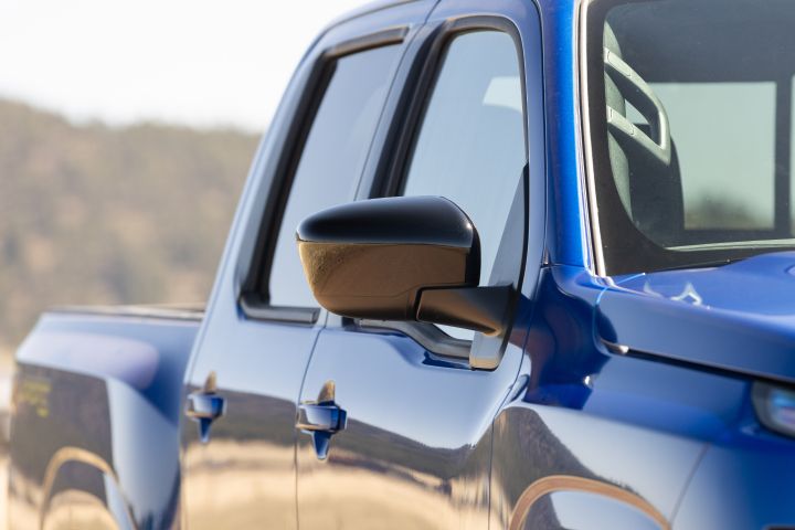 Close up of the side mirror and doors on the 2027 Nissan Frontier Sport Edition.