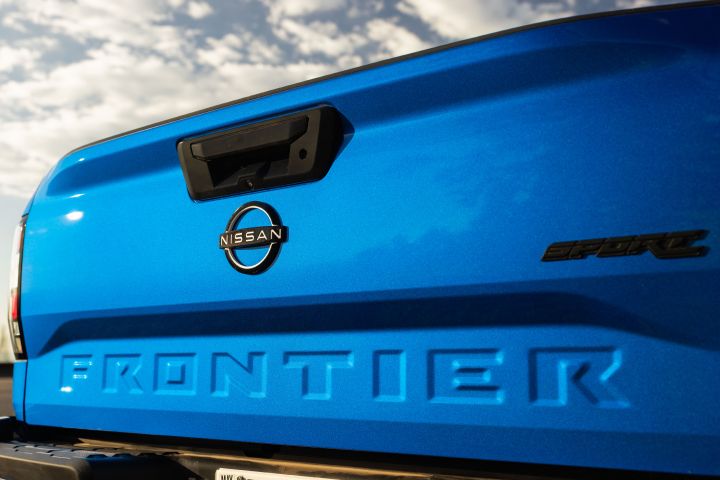 Close up of the tailgate on the 2027 Nissan Frontier Sport Edition in direct sunlight.