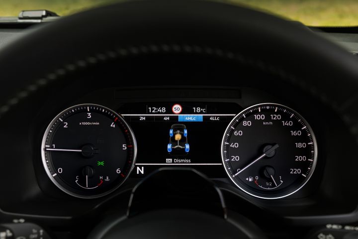 Instrument panel view of the 7-inch TFT Display Instrument Cluster in a 2026 Nissan Navara ST‑X, showing the four-wheel-drive selection display with the driveline graphic and mode indicators across the top.