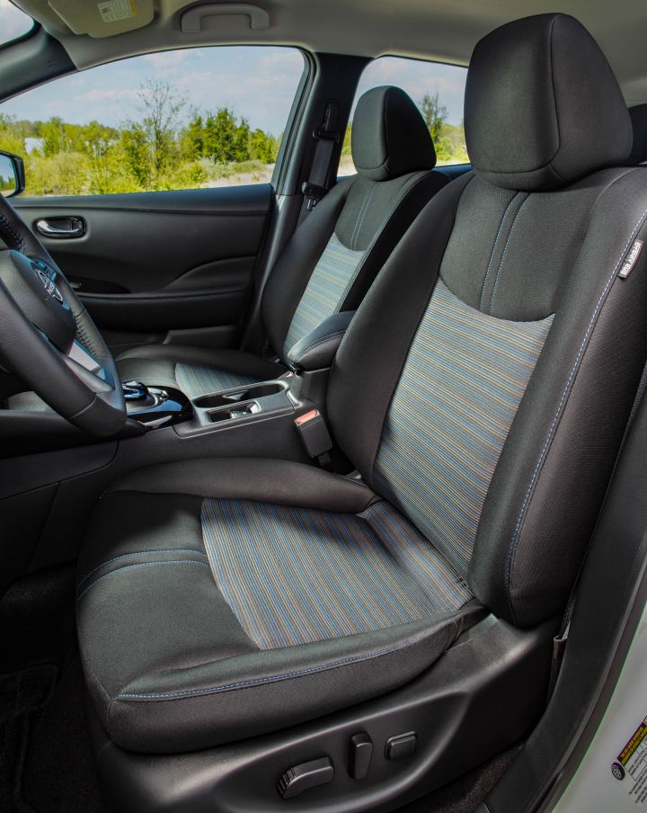 View of the dark cloth driver and passenger seats inside the 2025 Nissan LEAF