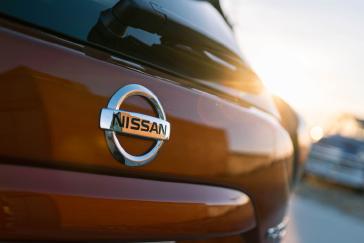 The Nissan logo on the rear of a vehicle