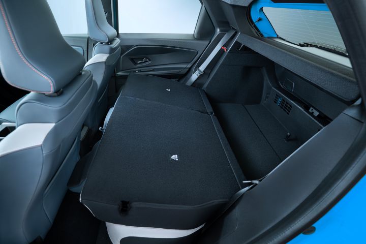 interior detail shot of collapsed rear seats revealing trunk space