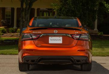 Rear profile view of an orange 2020 Nissan Maxima