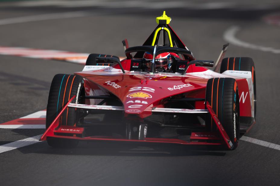 Nissan Formula E driver Oliver Rowland in a red race car on the track in the Monaco E-Prix