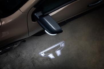 The TITAN Logo Approach Light illuminates the ground near the front doors with the TITAN logo.