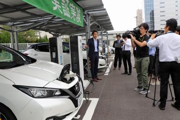 A trial using Nissan LEAF electric cars to help power office buildings has proved successful in cutting energy costs and CO2 emissions.