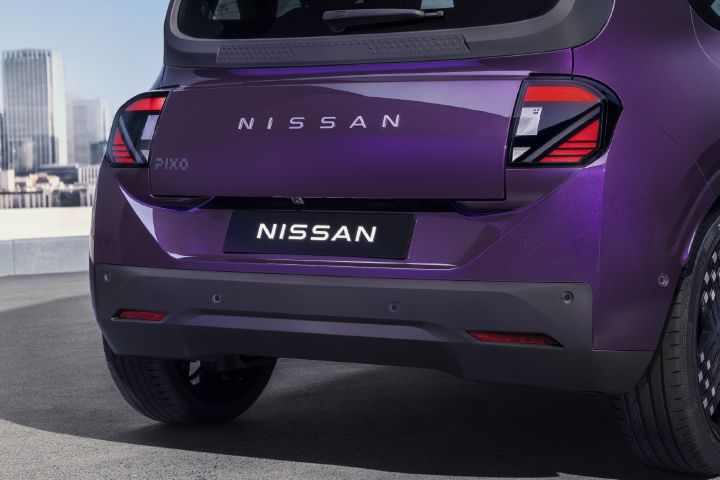 Close-up of the Nissan PIXO rear tailgate, showing the Nissan lettering, PIXO badge and distinctive rear light design.