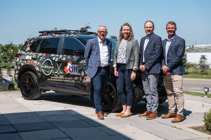 From left to right: Dan MacKenzie, President of the Canadian Hockey League (CHL), Kristina Herder, director of marketing at Nissan Canada Inc., Steve Rhind, president of Nissan Canada, and Bryan Crawford, Commissioner of the Ontario Hockey League (OHL), pose in front of a 2026 Nissan Rogue wrapped with CHL and Nissan branding.