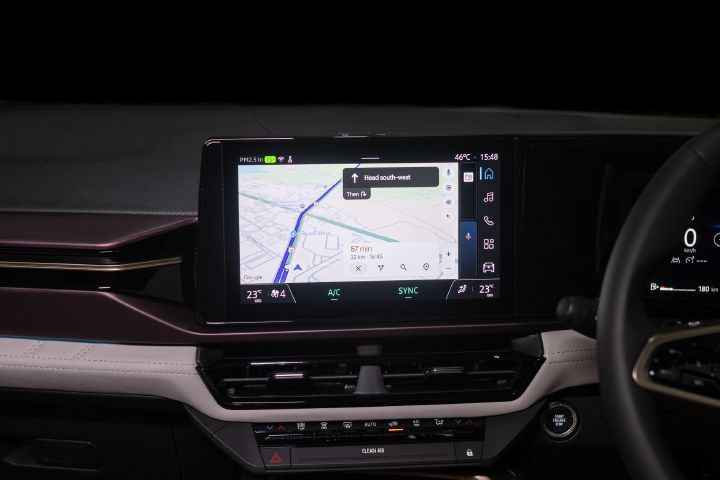 Navigation map displayed on the Tekton’s central touchscreen, showing turn-by-turn directions and climate controls.