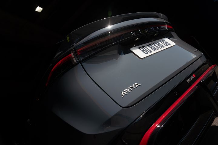 Rear static shot of the Ariya NISMO showing the red trim and both Ariya and NISMO logos