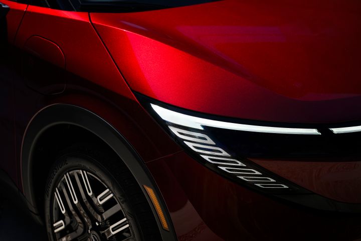Close up of the headlight illuminated in the dark on the 2026 Nissan LEAF.