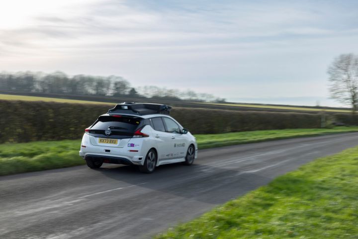 Dynamic rear shot of evolvAD on rural roads