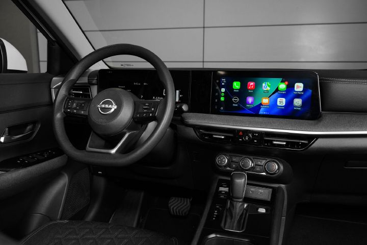 Angled view of the steering and dashboard inside the 2026 Nissan Kicks.