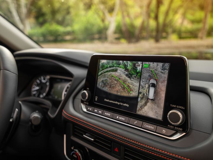 Close up of the infotainment screen with the parking cameras displayed inside the 2025 Nissan Rogue rock creek.