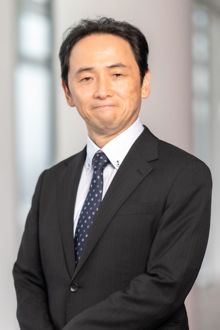 Portrait of Eiichi Akashi (suit, tie and NISSAN corporate pin)