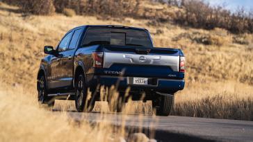 2020 Nissan TITAN blue in color parked on rural road