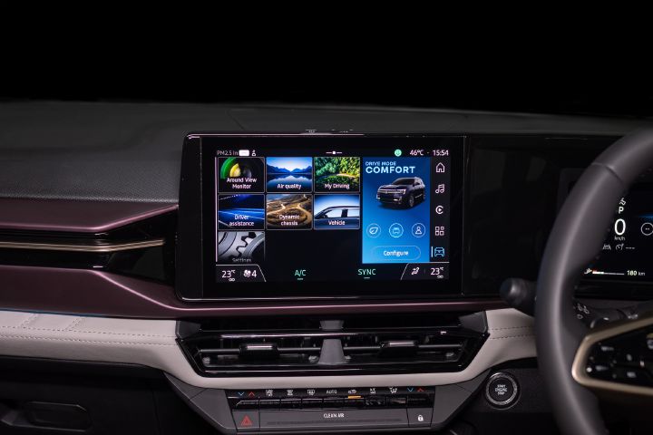 Vehicle settings and drive mode controls displayed on the Tekton’s central touchscreen.